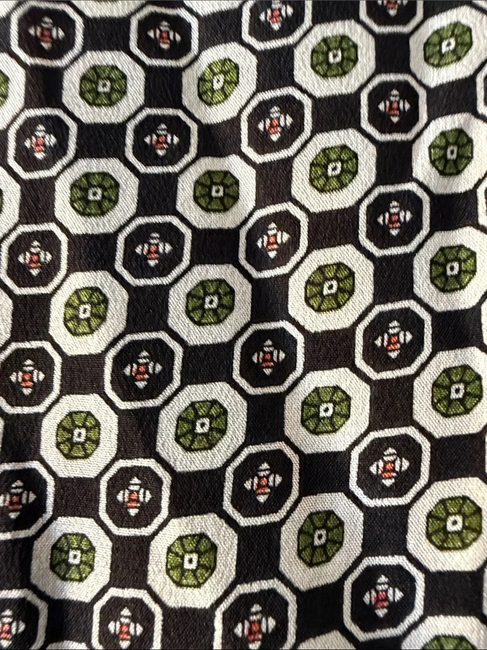 No brand reversible circular neck scarf. Black with pattern.